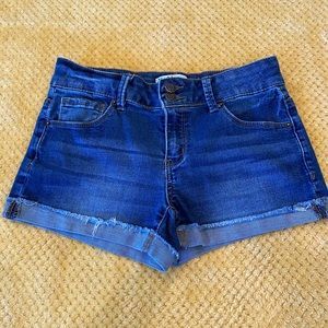 Girls dark blue denim shorts.